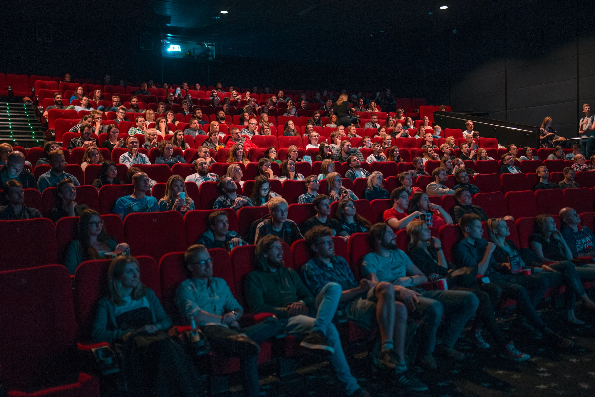 A movie audience that sits and watches and indie film in theaters.